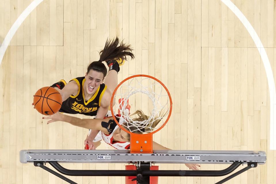 COLUMBUS, OHIO - JANUARY 21: Caitlin Clark #22 of the Iowa Hawkeyes shoots the ball over Jacy Sheldon #4 of the Ohio State Buckeyes during the second quarter of the game at Value City Arena on January 21, 2024 in Columbus, Ohio. Ohio State defeated Iowa 100-92 in overtime. (Photo by Kirk Irwin/Getty Images)