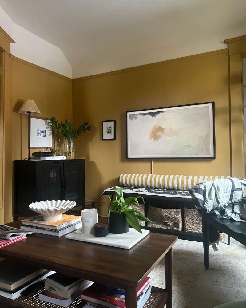 Warm yellow walls in bedroom.