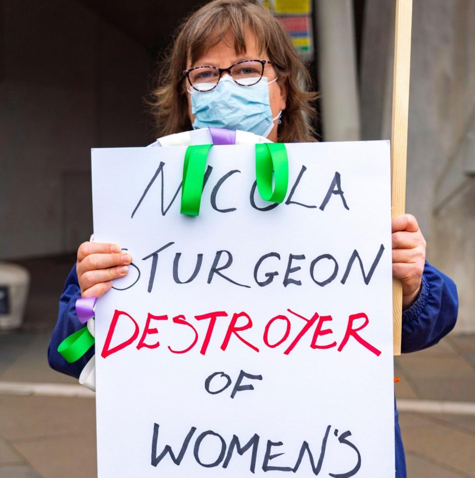 A protester labeled Nicola Sturgeon a destroyer of women's rights during a demonstration at Holyrood in 2021