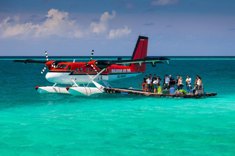 A seaplane arrived at the floating platform near the island resort on Bathala island, Maldives