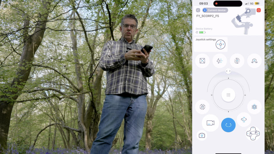 FeiyuTech Scorp 2 gimbal app sowing the user interface and an image of a man in a wooded area