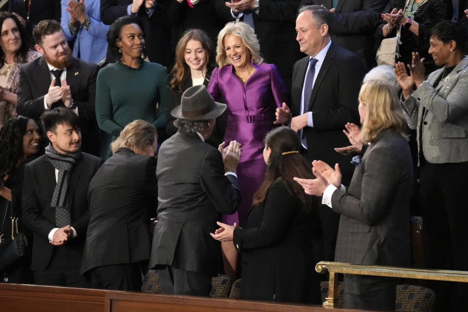 First lady Jill Biden greets her guests as she arrives in the first lady's box in the House chamber before President Joe Biden arrives to deliver the State of the Union address to a joint session of Congress at the U.S. Capitol, Tuesday, Feb. 7, 2023, in Washington. (AP Photo/Patrick Semansky)