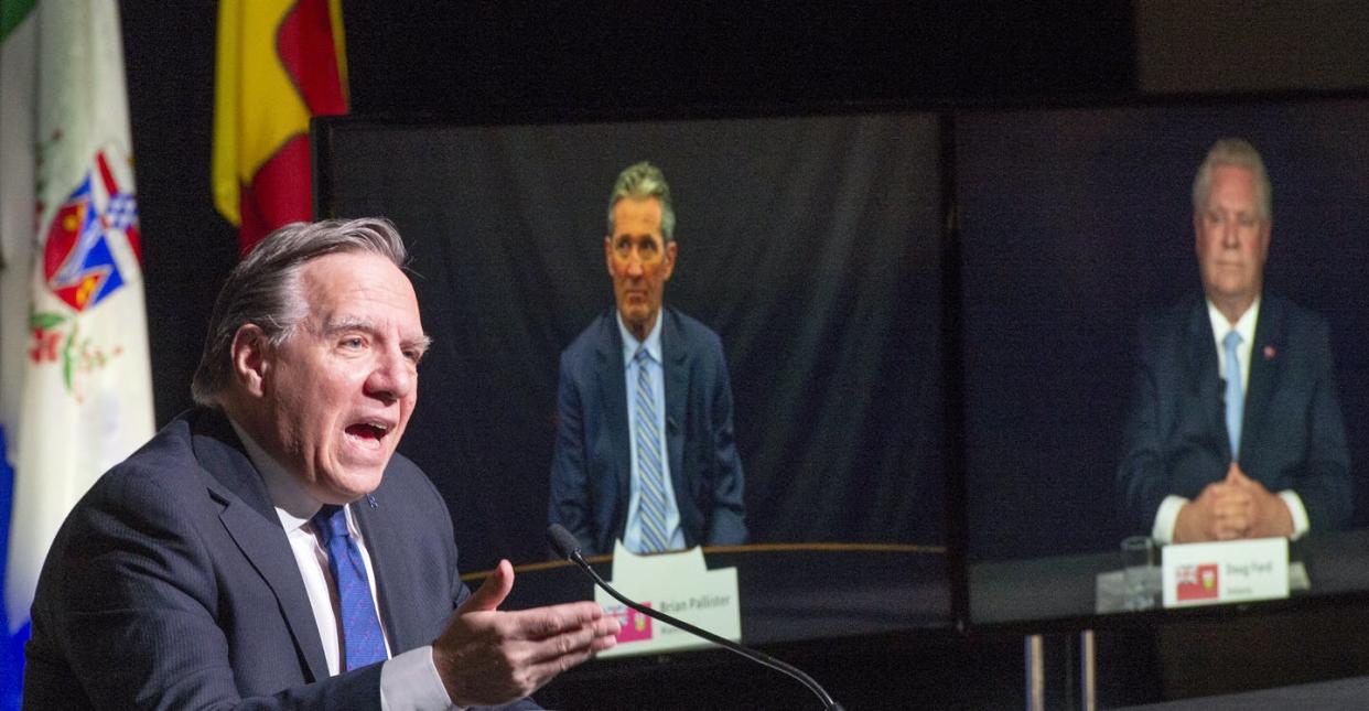 <span class="caption">Québec Premier François Legault chairs a premiers virtual news conference as premiers Brian Pallister, Manitoba, and Doug Ford, Ontario, are seen on screen on March 4, 2021 in Montréal. </span> <span class="attribution"><span class="source">THE CANADIAN PRESS/Ryan Remiorz</span></span>