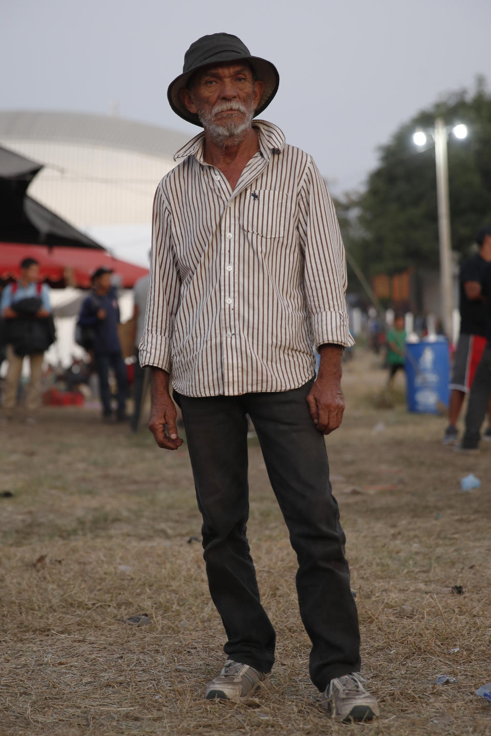 Candido de Jesus Pineda, a 62-year-old Honduran migrant, poses for a portrait at a temporary shelter set up by authorities for migrants arriving to Tecun Uman, Guatemala on the border with Mexico, Tuesday, Jan. 21, 2020. Jesus Pineda said he left behind two teenage daughters in Honduras and that his trek by foot was a better option than staying at home in a difficult economic situation. (AP Photo/Moises Castillo)