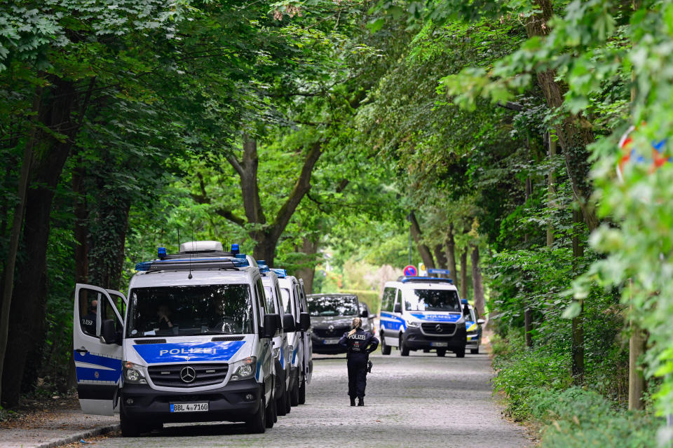 Police officers take part in the search for a wild animal on the loose, reportedly a lioness, in Stahnsdorf, southwest of Berlin, Germany, July 20, 2023. / Credit: JOHN MACDOUGALL/AFP/Getty