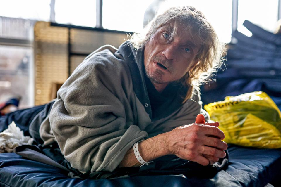 Shane Young lays on a mat on Jan. 13 at the Homeless Alliance day shelter in Oklahoma City.