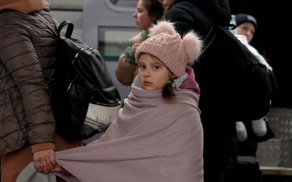 Refugees fleeing the war in Ukraine arrive at the train station in Przemysl, Poland - Markus Schreiber/AP