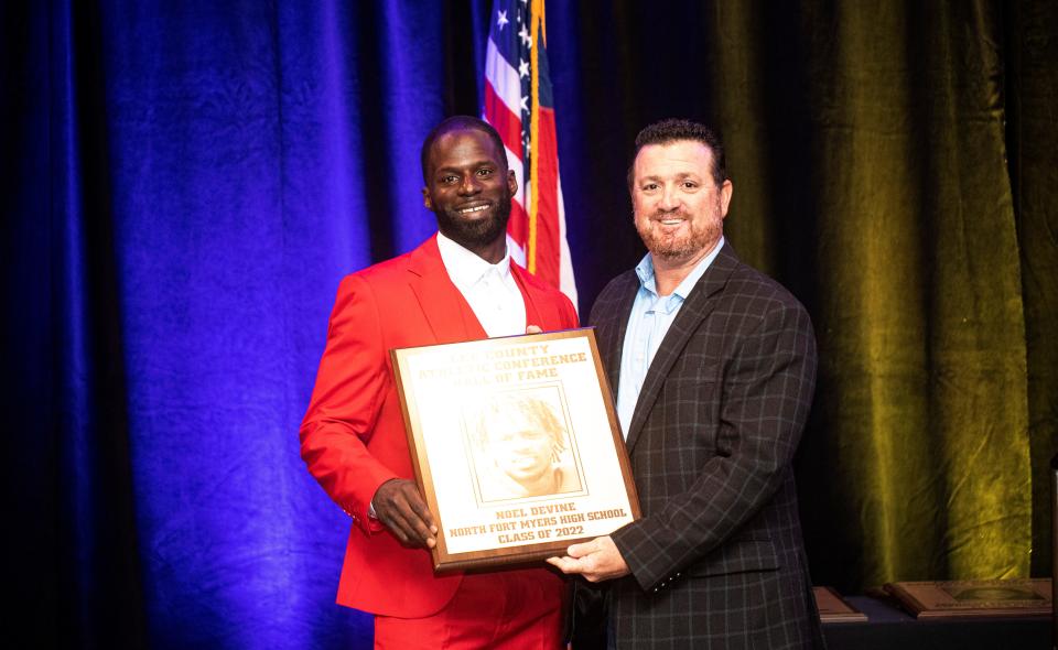 Noel Devine, a star football player at North Fort Myers High School was inducted into the 2022 Lee County Athletic Conference Hall of Fame at Crowne Plaza in Fort Myers on Thursday, April 21, 2022.  He is seen with former North Fort Myers High School football coach, James Iandoli.