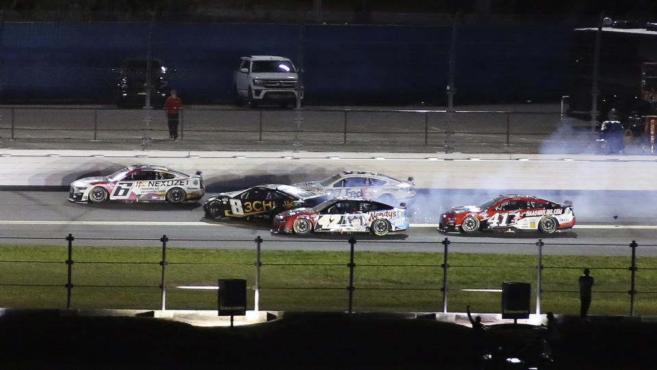 Kyle Busch (8) goes sideways before crashing in the wall as Brad Keselowski (6), Noah Gragson (42), Denny Hamlin (11) and Ryan Preece (41) look to avoid crashing during the second of two qualifying auto races for the NASCAR Daytona 500 at Daytona International Speedway, Thursday, Feb. 16, 2023, in Daytona Beach, Fla. (AP Photo/Jim Topper)