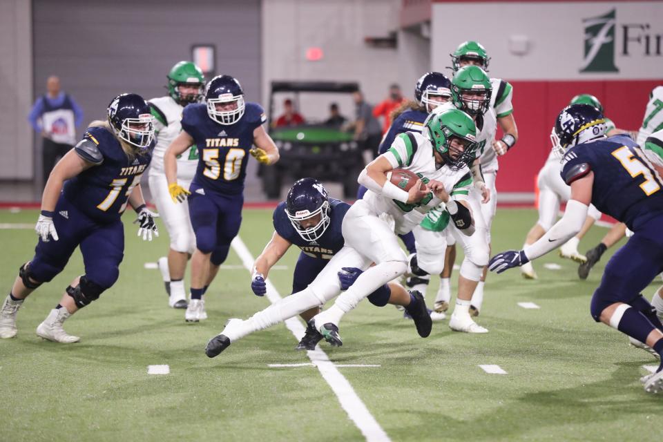 Pierre Governors QB Lincoln Kienholz (3) rushes up the middle during the 11AA State Championship game Friday night in the Dakota Dome. Kienholz won the Joe Robbie MVP trophy and the Pierre Governors won 30-27.