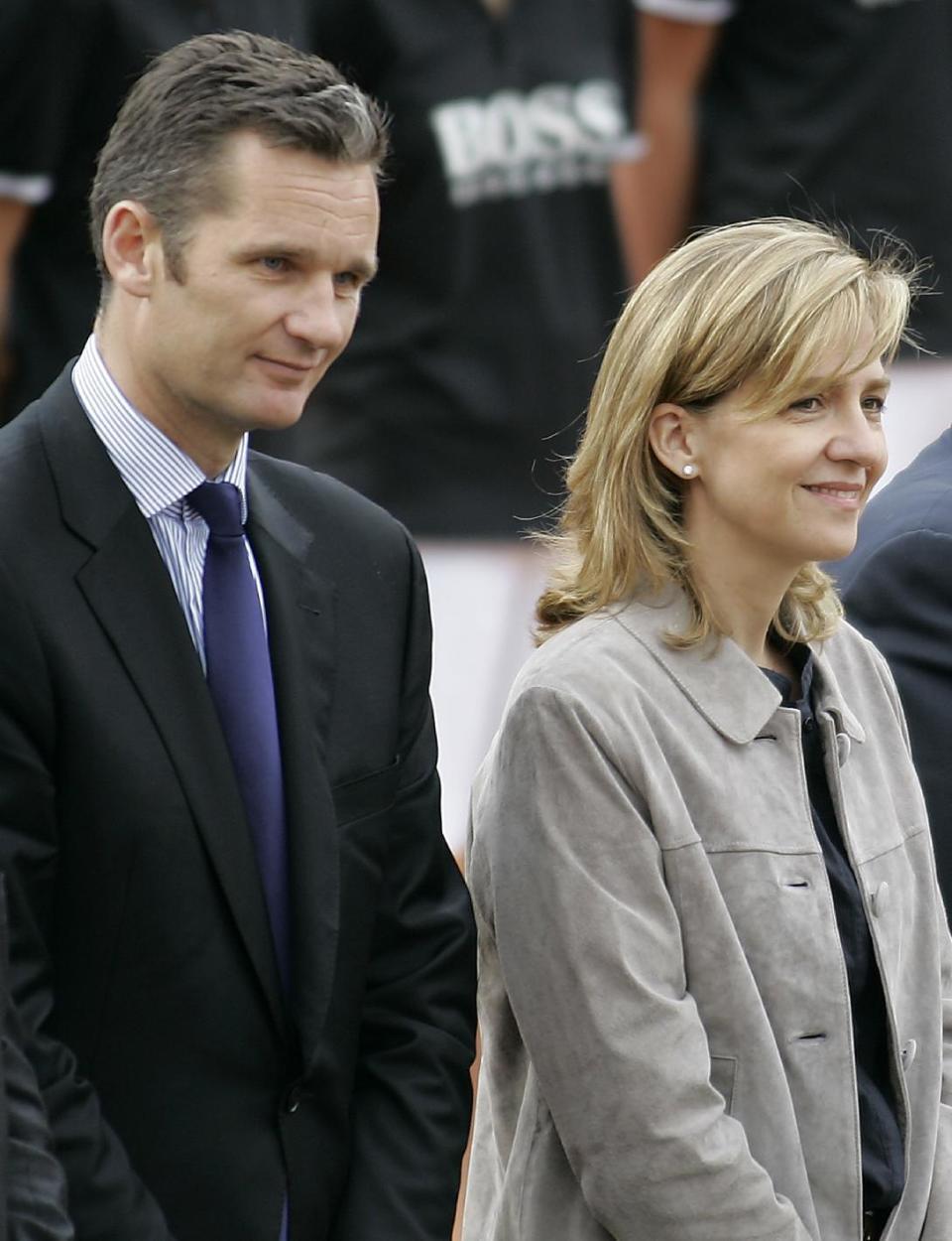 FILE- Spain's Princess Cristina, right, and her husband Inaki Urdangarin, left, are seen during the Barcelona Open Tennis Tournament final match in Barcelona, Spain, in this file photo dated Sunday, April 26, 2009. A Spanish court has named the king's daughter Princess Cristina Wednesday April 3, 2013, as a suspect in an alleged corruption case involving her husband, and the court has announced that it will call her for questioning. The Spanish royal palace refused to comment Wednesday. (AP Photo/ David Ramos, File)