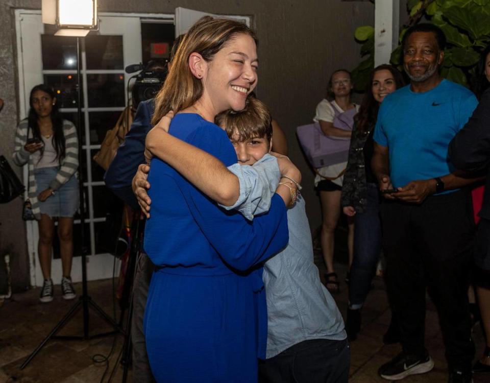 Sabina Covo, la ganadora de la elección especial del Distrito 2 en Miami recibe un abrazo de su hijo Paolo, de 10 años, durante una celebración en The Taurus en Coconut Grove. José A. Iglesias jiglesias@elnuevoherald.com
