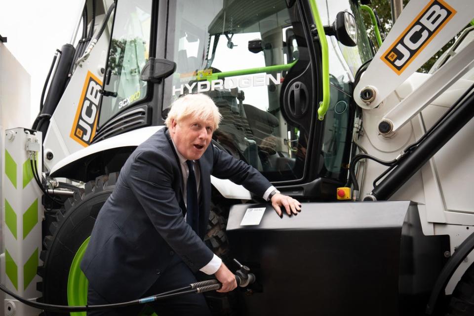 Prime Minister Boris Johnson unveiled a hydrogen-powered JCB telescopic handler, as the construction equipment firm announced it is investing £100m in a project to produce super-efficient hydrogen engines (Stefan Rousseau/PA) (PA Wire)