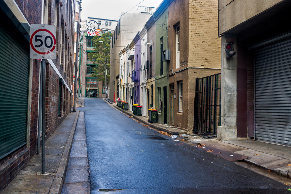 Sydney, Australia - March 13, 2015: A narrow lane in old Surry Hills an area of Sydney known for its cultural and cafe scene.