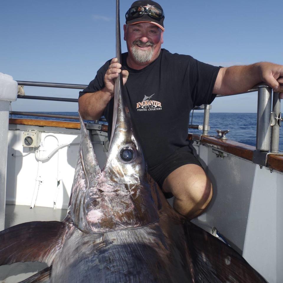 Pictured is Enchanter captain Lance Goodhew holding a fish.