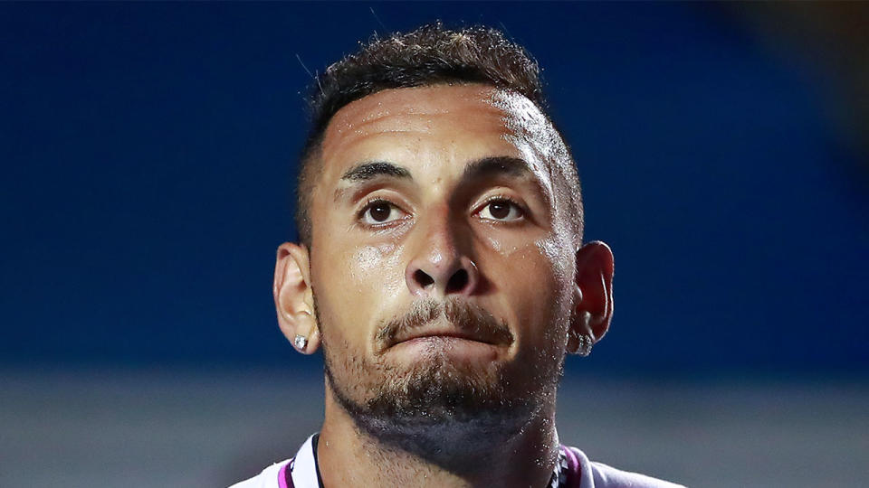 Nick Kyrgios looking dejected during a match.