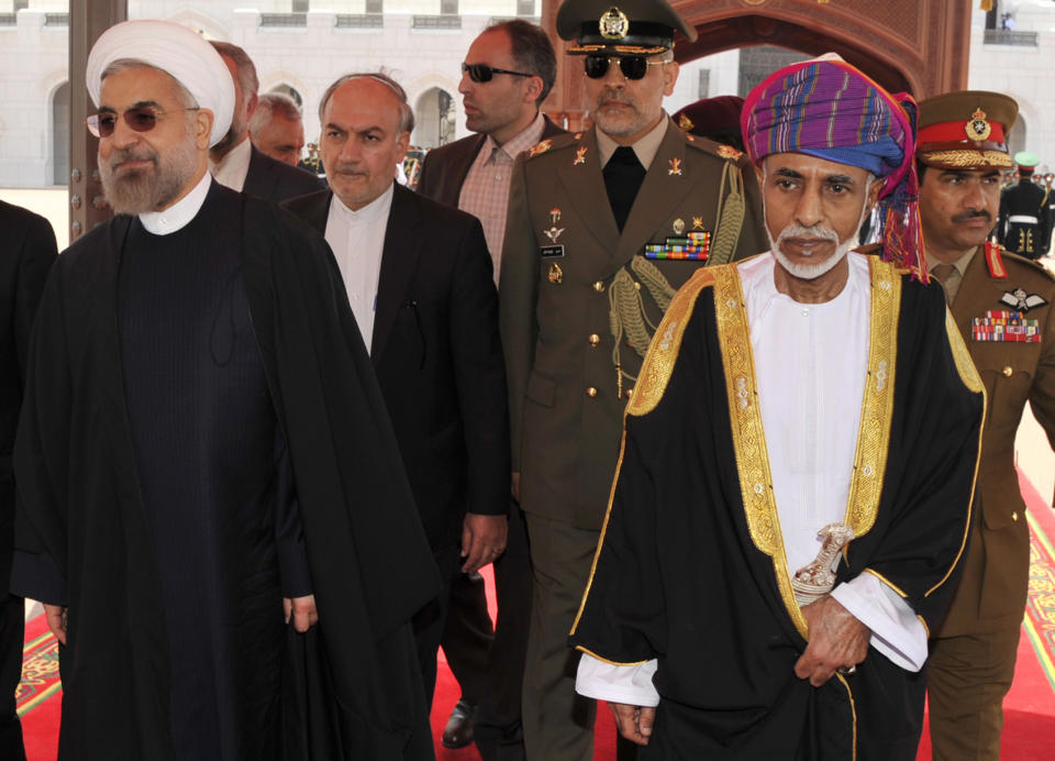 Sultan Qaboos, second right, receives Iranian president Hassan Rouhani, left, at Al Alalam Palace in Muscat, Oman, Wednesday, March 12, 2014. Rouhani is in Oman for a two day visit. (AP Photo/Abo Zayed)