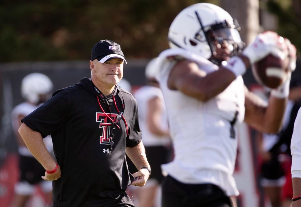 Texas Tech coach Joey McGuire watches receiver Myles Price catch a pass during a recent session of preseason practice. The Red Raiders, coming off an 8-5 season with a bowl victory, open this season on Sept. 2 at Wyoming.