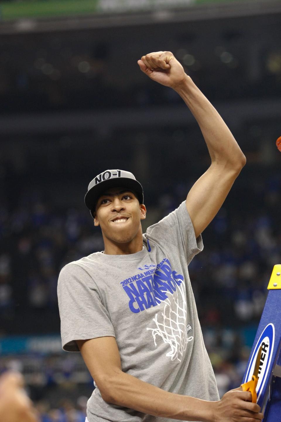 Kentucky's Anthony Davis gets ready to cut down the nets.Apr. 2, 2012