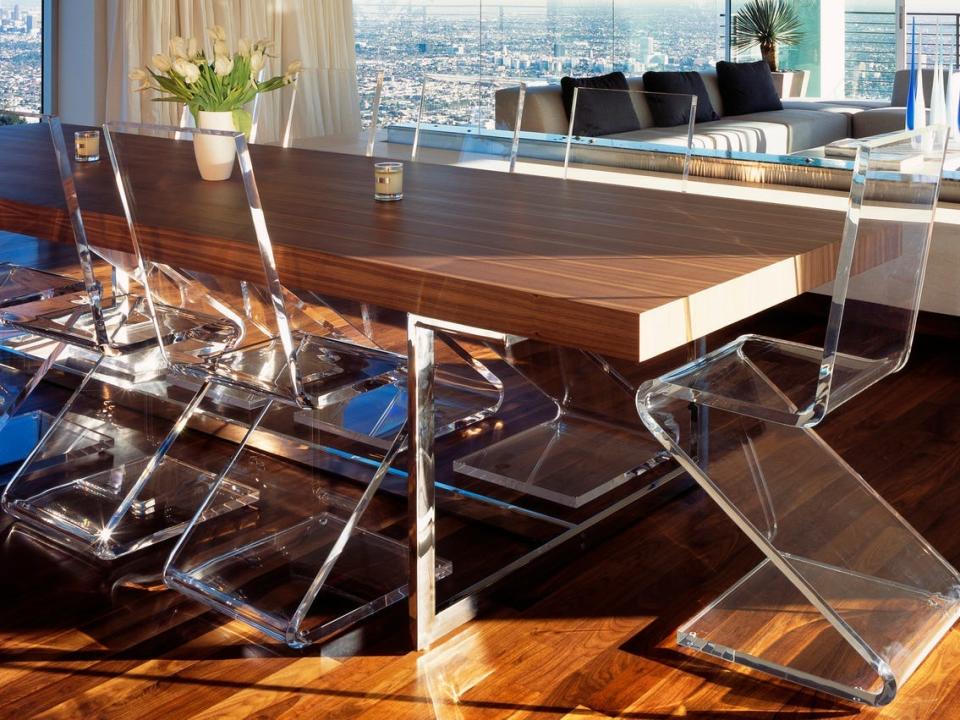 Acrylic dining chairs at table