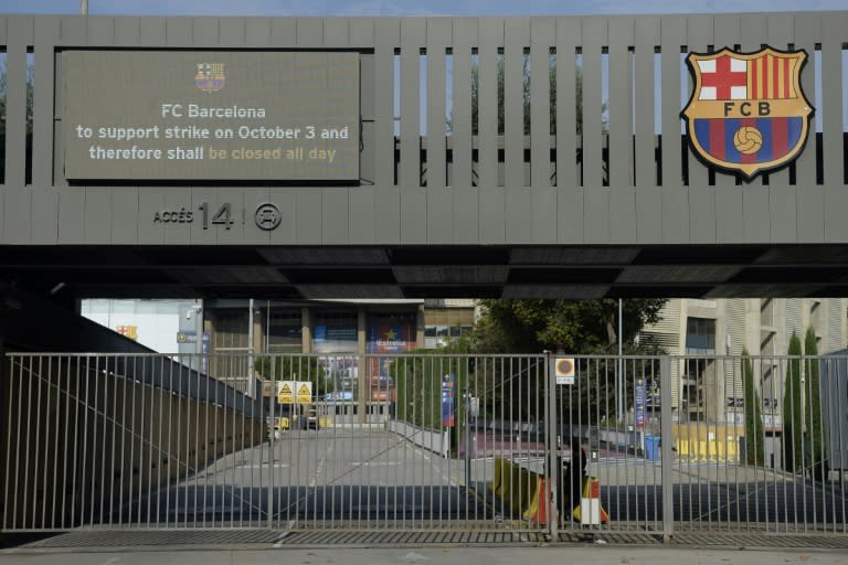 A message board outside Barcelona FC's Camp Nou stadium announces that the site is closed as part of a general strike in Barcelona called by Catalan unions, on October 3, 2017