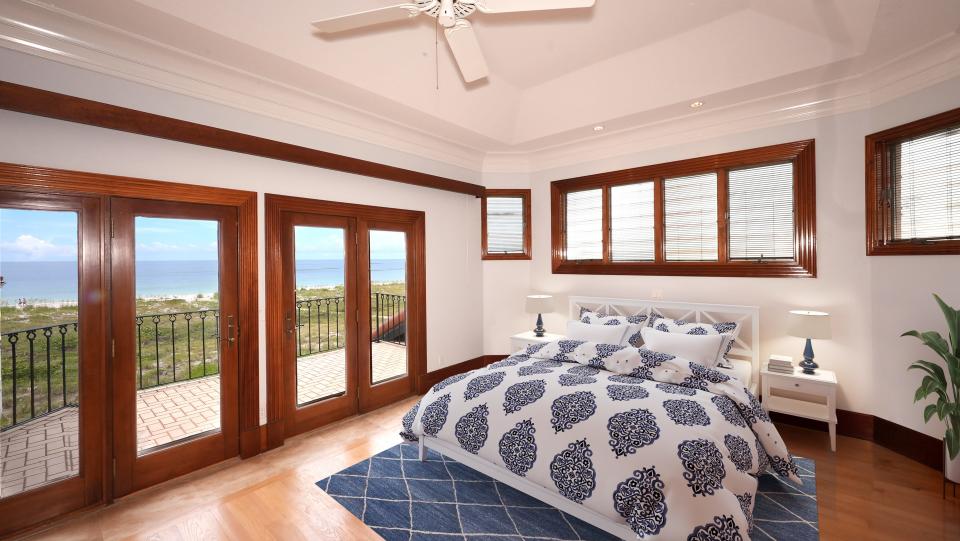 The upper level bedrooms have oak floors, big windows, balconies and French doors.