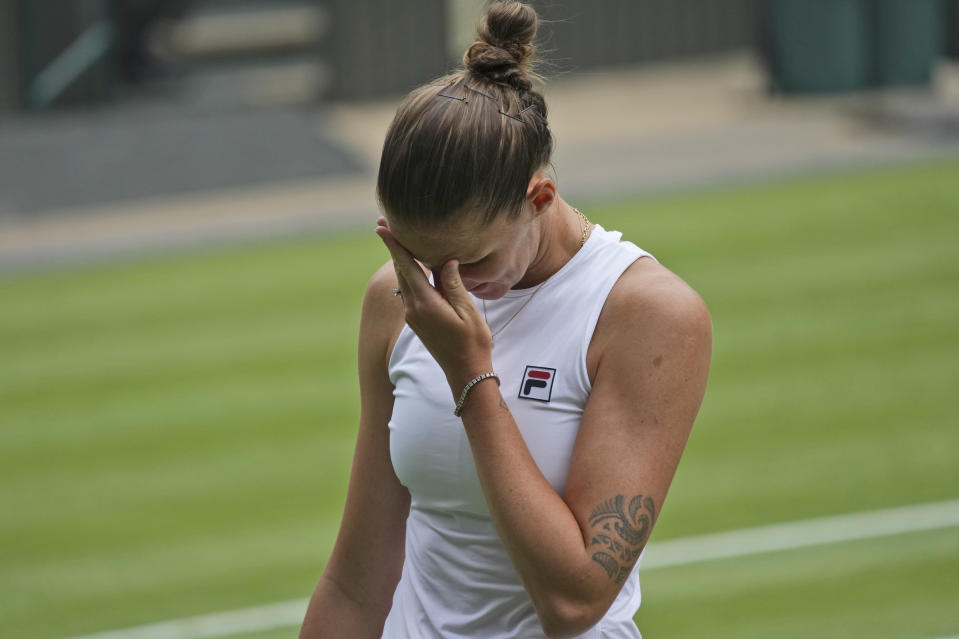 Czech Republic's Karolina Pliskova reacts after losing a point to Australia's Ashleigh Barty during the women's singles final match on day twelve of the Wimbledon Tennis Championships in London, Saturday, July 10, 2021. (AP Photo/Alberto Pezzali)