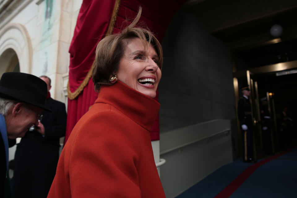 Pelosi debuted the red Armani coat at the inauguration of Obama’s second term. (Photo: Getty Images)