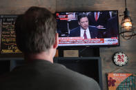<p>Customers at R Public House watch as former FBI Director James Comey testifies before the Senate intelligence committee on June 8, 2017 in Chicago, Illinois. (Scott Olson/Getty Images) </p>