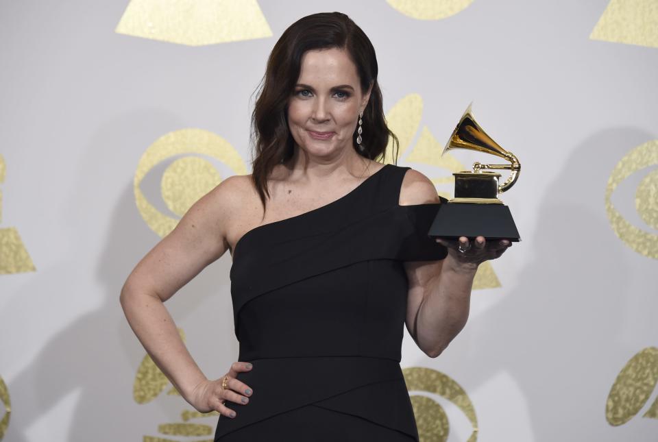 Songwriter Lori McKenna poses in the press room with the award for best country song for "Humble and Kind" by Tim McGraw at the 59th annual Grammy Awards at the Staples Center on Sunday, Feb. 12, 2017, in Los Angeles.