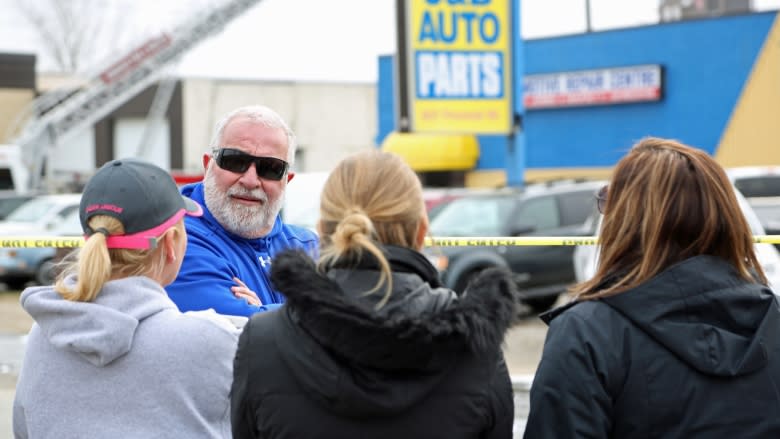 Auto shop owner could only watch as business burned