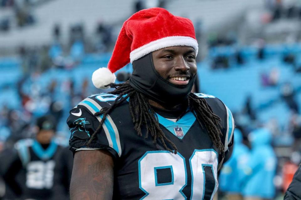 Panthers tight end Ian Thomas gets festive as he walks off the field after a win over the Lions, 37-23, on Saturday, December 24, 2022.