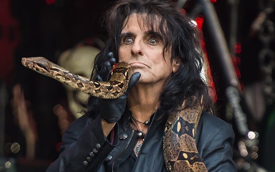 A python opening its bowels on stage (and on Alice Cooper) made members of the crew throw up - Splash News