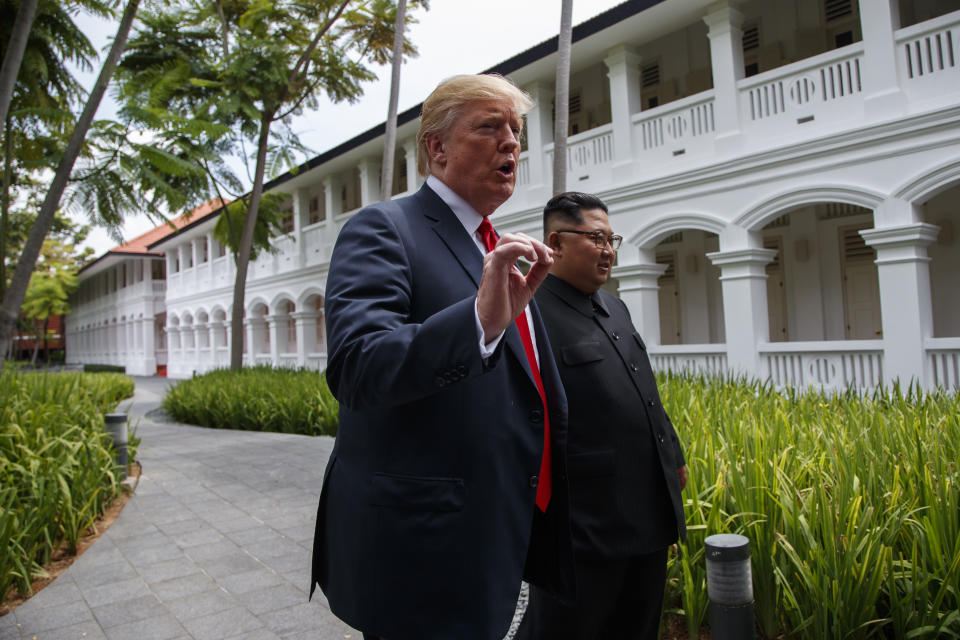 President Donald Trump walks with North Korean leader Kim Jong Un on Sentosa Island, Tuesday, June 12, 2018, in Singapore. (AP Photo/Evan Vucci)