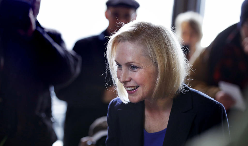 Sen. Kirsten Gillibrand, D-NY, smiles as she listens to a patron while visiting a coffee shop on Main Street in Concord, N.H., Friday, Feb. 15, 2019. Gillibrand visited New Hampshire as she explores a 2020 run for president. (AP Photo/Charles Krupa)