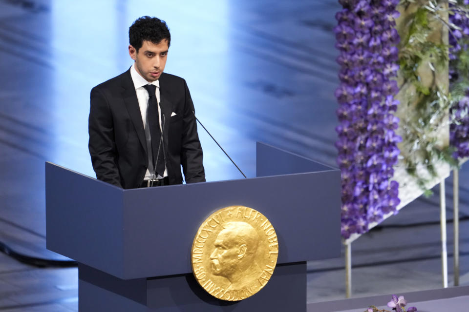 Ali Rahmani gives part of the Nobel Peace Prize lecture in his mother’s name, imprisoned Iranian activist Narges Mohammadi during the awarding of the Nobel Peace Prize for 2023 in Oslo City Hall, Oslo, Norway, Sunday, Dec. 10, 2023. Mohammadi is renowned for campaigning for women's rights and democracy in her country, as well as fighting against the death penalty. (Fredrik Varfjell/NTB via AP)