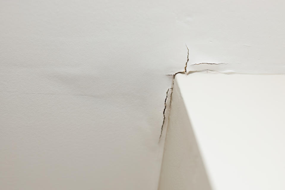 Low angle view of a ceiling damaged by water from roof leak