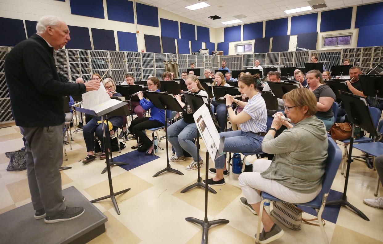 Director James Swearingen leads the Grove City Community Winds band during rehearsal at Jackson Middle School on May 2. The band will perform May 27 to kick off Grove City's Summer Sizzle concert series at the historic Town Center, 3359 Park St.