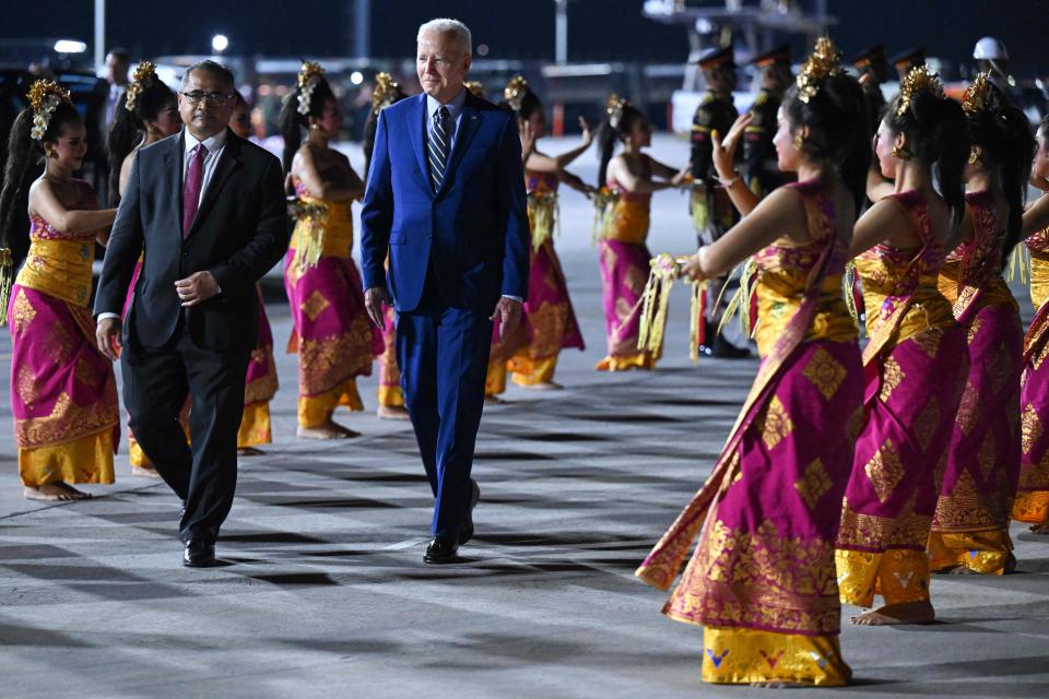 President Joe Biden disembarks from Air Force One upon arrival at Ngurah Rai International Airport in Denpasar on the Indonesian resort island of Bali, on Nov. 13, 2022, as he travels to attend the G-20 Summit.