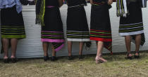 Naga girls watch celebrations marking their Declaration of Independence in Chedema, in the northeastern Indian state of Nagaland, Sunday, Aug. 14, 2022. The Nagas - an indigenous people inhabiting several northeastern Indian states and across the border in Myanmar - marked the 75th anniversary of their declaration of independence on Sunday. (AP Photo/Yirmiyan Arthur)