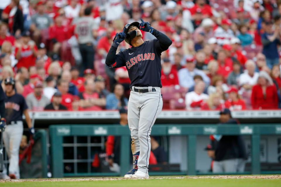 Cleveland Guardians shortstop Andres Gimenez (0) celebrates a two-run home run in the ninth inning of the MLB Inter-league game between the Cincinnati Reds and the Cleveland Guardians at Great American Ball Park in downtown Cincinnati on Tuesday, April 12, 2022. The Guardians won 10-5 in the Reds home-opening game. 