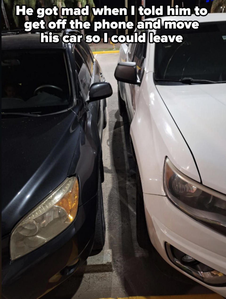 Two cars parked closely beside each other, making it difficult for either driver to access their vehicle