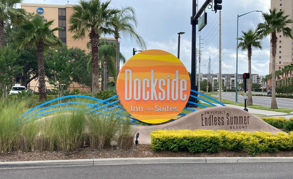 round orange sign outside of dockside resort at entrance