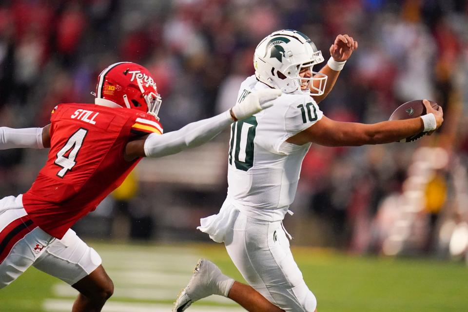 Michigan State quarterback Payton Thorne runs with the ball as Maryland defensive back Tarheeb Still tries to stop him during the second half of MSU's 27-13 loss on Saturday, Oct. 1, 2022, in College Park, Maryland.