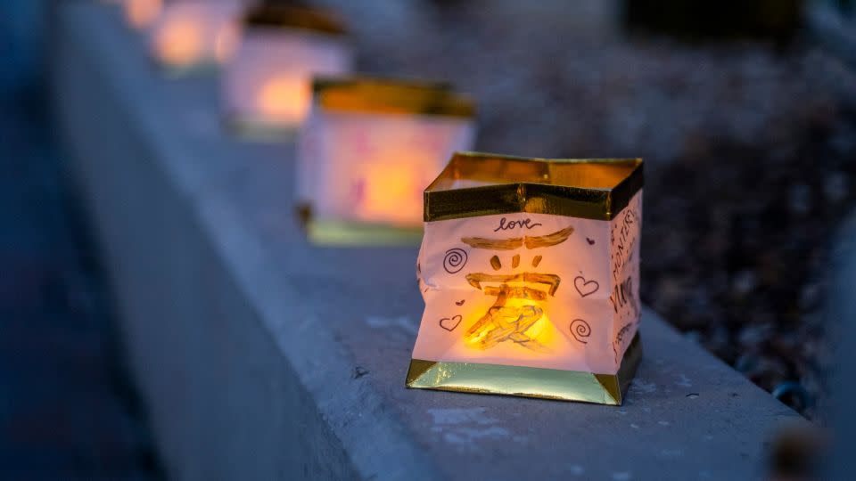 A hand-decorated lantern flickers during a one-year anniversary vigil for the Monterey Park shooting victims. - Ringo Chiu/AP