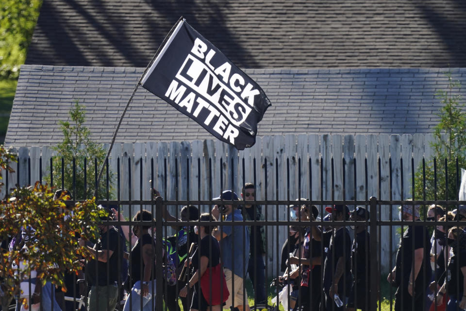 Protesters march past the Churchill Downs racetrack before the 146th running of the Kentucky Derby horse race, Saturday, Sept. 5, 2020, in Louisville, Ky. (AP Photo/Charlie Riedel)