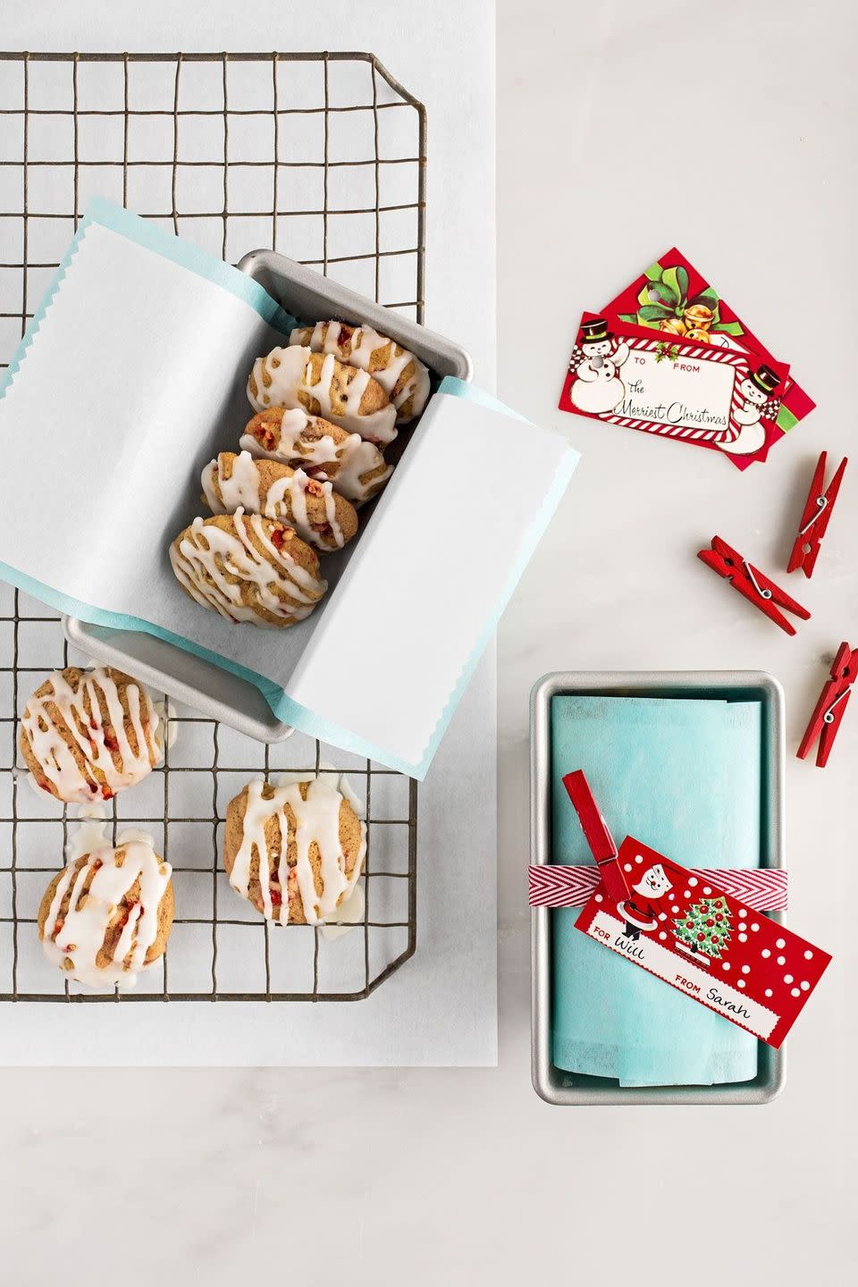 <p>Line a mini loaf pan with plain tissue paper then wax paper. Add cookies, fold over paper, then wrap with ribbon and attach a card with a mini clothespin.</p><p><strong><a href="https://www.countryliving.com/food-drinks/recipes/a36899/fruitcake-cookies/" rel="nofollow noopener" target="_blank" data-ylk="slk:Get the recipe for Fruitcake Cookies;elm:context_link;itc:0;sec:content-canvas" class="link ">Get the recipe for Fruitcake Cookies</a>.</strong></p>