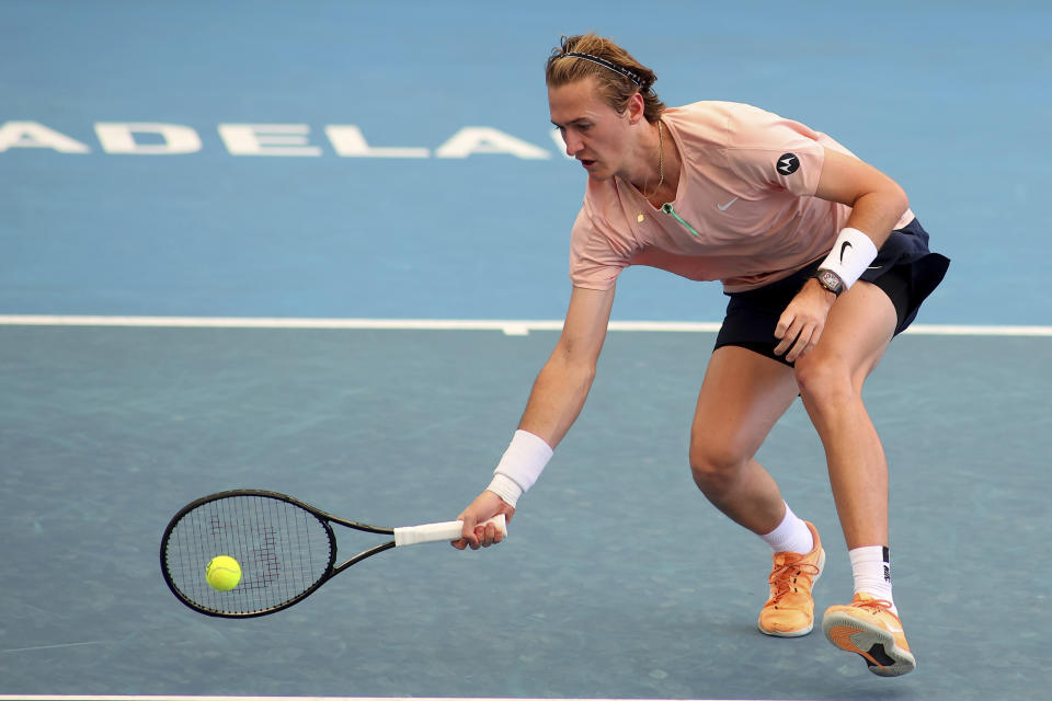 The United States' Sebastian Korda makes a forehand return to Japan's Yoshihito Nishioka in the semifinal match at the Adelaide International Tennis tournament in Adelaide, Australia, Saturday, Jan. 7, 2023. (AP Photo/Kelly Barnes)