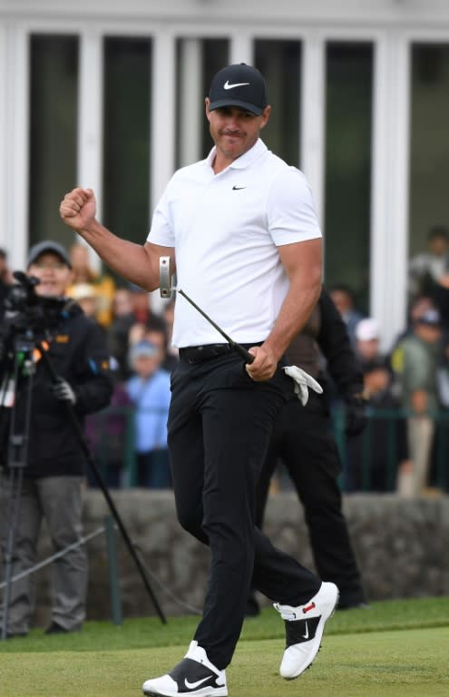 Brooks Koepka celebrates his winning putt for eagle on 18 in South Korea