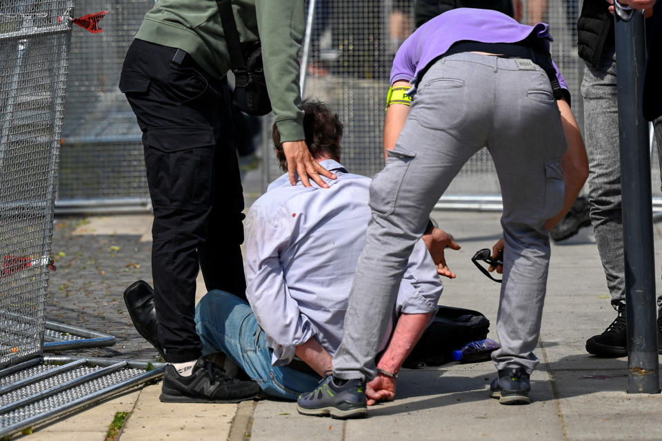 A person is detained after shooting incident of Slovak PM Robert Fico, after a Slovak government meeting in Handlova, Slovakia, May 15, 2024. REUTERS/Radovan Stoklasa